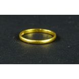 A 22ct gold wedding band, of plain design, ring size P, 2g all in.