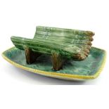 A Victorian Majolica asparagus stand, moulded with asparagus with pierced base on a rectangular