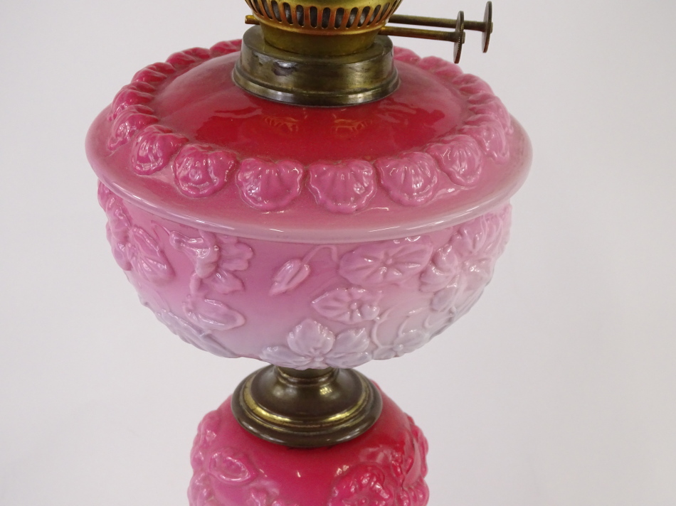 A Victorian pink opaque glass oil lamp, the Art Nouveau style frosted shade decorated with - Image 2 of 2