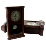 Two 1920's oak wall clocks, each with silvered dials and Arabic numerals, 70cm and 49cm H