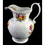A mid 19thC Staffordshire porcelain jug, painted with flowers and with flowers moulded in relief,