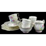 A Shelley part tea service, decorated with Art Deco style flowers, trees etc., pattern number 12812,