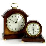 A mahogany mantel timepiece in George III style, the case inlaid with marquetry fans, the dial