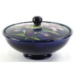 A Moorcroft iris pattern powder bowl and cover, with tube decoration to the lid, impressed marks