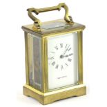 A Mappin & Webb brass carriage timepiece, with hinged handle, 15cm H overall.