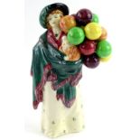 A Royal Doulton porcelain figure The Balloon Seller, HN583, 23cm H.