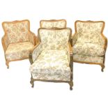 A set of four early 20thC beech continental show frame armchairs, each with floral fabric on