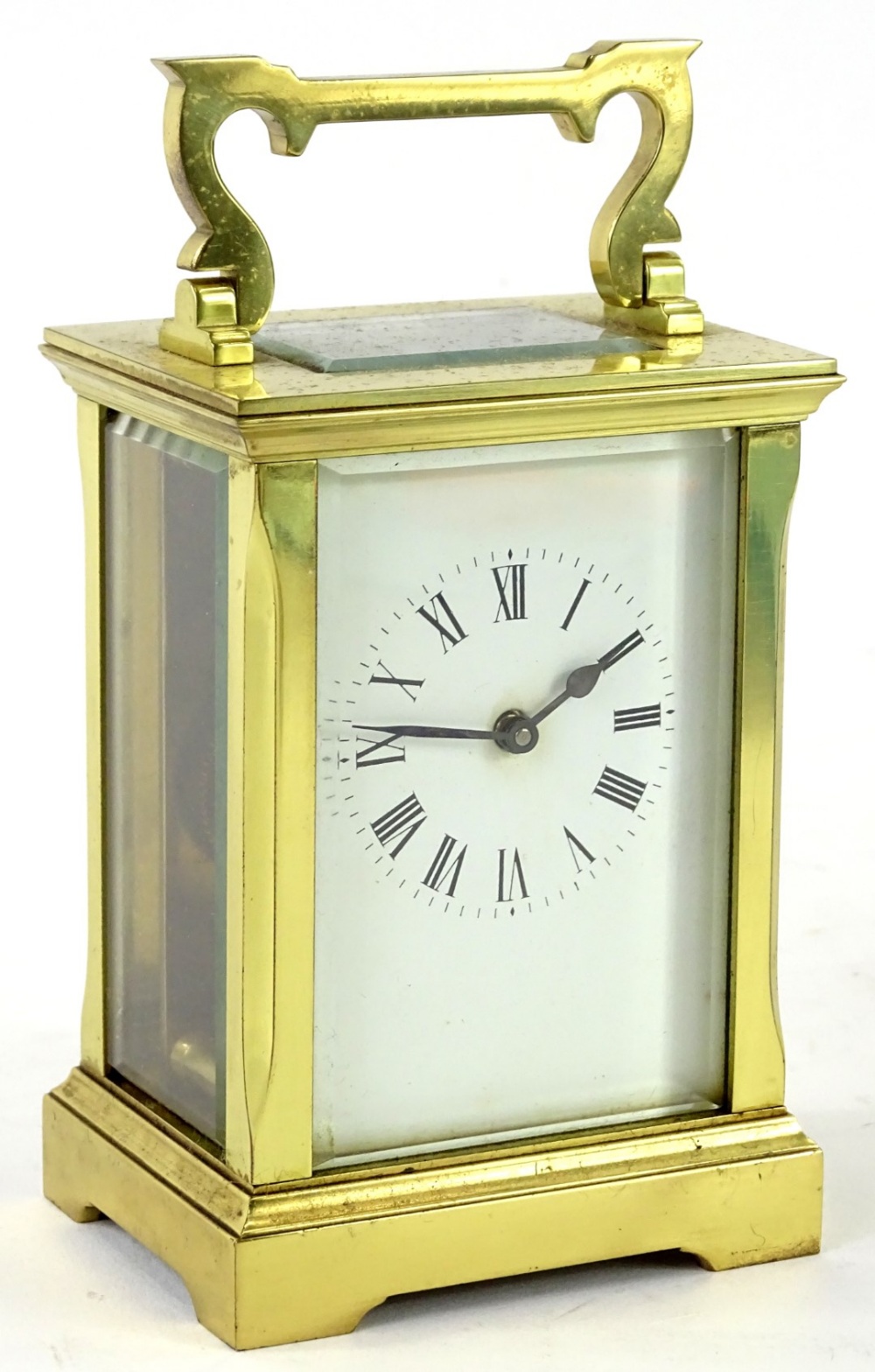 A French brass carriage timepiece, the white enamel dial with Roman Numerals, 15cm H.Provenance: