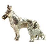 A silver coloured metal model of a German Shepherd or Alsatian, 6cm L and a similar silver plated