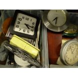 A quantity of mainly quartz wall clocks, various makers and materials used. (2 boxes)Provenance: