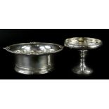 A silver bon bon dish, with a foliate scroll border, on hourglass shaped stem, and loaded base,