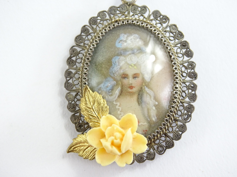 An imitation Monet filigree silver brooch, the front depicting figure of a maiden looking left, with - Image 2 of 3