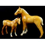 Two Beswick bay foals, the largest 12cm H.