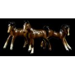 Three Beswick brown foals, the largest 8cm H.
