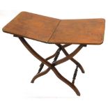 A 19thC mahogany folding coaching table, on x shaped supports with spindle turned stretcher, the top