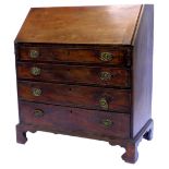 A George III mahogany bureau, the fall enclosing a fitted interior, above four graduated drawers