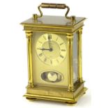 A Bentina brass carriage clock, with gilt dial, decorated with Roman Numerals, aperture for pendulum