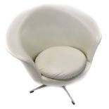 A retro style cream leatherette revolving tub type chair, on an x shaped metal base.The upholstery