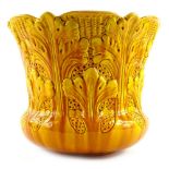 A Burmantoft pottery jardiniere, moulded with yellow flowers, impressed marks to underside, number