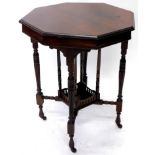An Edwardian walnut window type table, the octagonal top on turned reeded legs with galleried