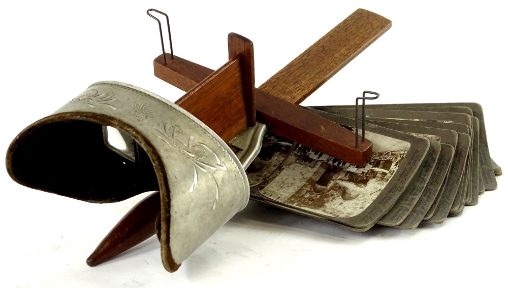 An aluminium and mahogany Underwood & Underwood stereo viewer, and collection of cards