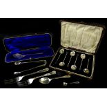 A collection of small silver, to include a set of six berry coffee spoons and other spoons, tongs