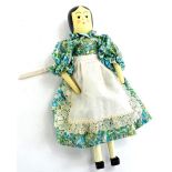 An articulated wooden peg doll, with painted face etc., possibly by Eric Horne of Topsham Devon,