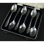 A George V set of six silver teaspoons, with a tapering handle, in a fitted case, Birmingham 1926,