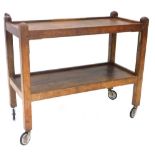 A Robert Thompson of Kilburn Mouseman oak two tier trolley, on square section supports, with