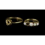 Two 9ct gold dress rings, to include a 9ct gold five stone opal ring, (1 stone missing), with scroll