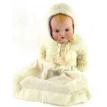 An Armand Marseille bisque headed doll, with sleeping eyes and composition limbs, numbered to the