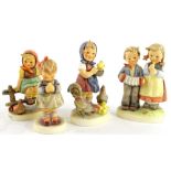 Four Goebel Hummel figures of children, to include a musician group and a chicken group, the largest
