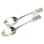 A pair of Continental silver plated fiddle pattern spoons, cast with shells, two masted sailing ship