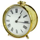 A late 19th/early 20thC French brass travelling clock, with a circular case, the white enamel dial