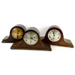 A collection of three Napoleons hat type mantel clocks, each with Westminster chime, one engraved