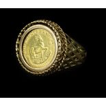 A coin ring, set with 1/10oz Krugerrand, in rope twist border, with pierced design band, yellow