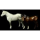 A Beswick grey horse, with original green label, 24cm W, and a brown horse. (2)