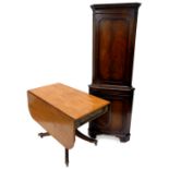 An early 19thC mahogany Pembroke table, with a rectangular top with rounded corners above a frieze