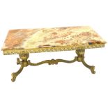 A gilt brass and onyx coffee table, the rectangular top with a moulded edge above a pierced frieze