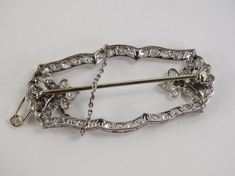 A diamond and sapphire Art Deco brooch, the design set with tiny diamonds, with a fan to each end, - Image 2 of 3