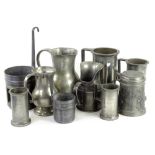 A collection of French pewter, to include two grain measures with loop handles, a plain