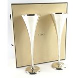 A pair of Links of London silver plated champagne flutes, each on a domed foot, with original box