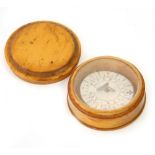 A 19thC pocket compass, in a turned boxwood case with push on lid, 6cm Dia.