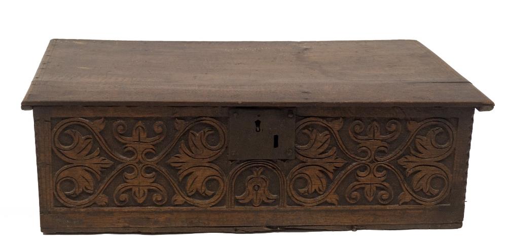 A 17thC oak bible box, with plain top, and front aspect with stylised Arabesque motifs and flower