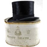 An early 20thC top hat, with black ribbon, Tress & Co Lazenby & Baxter label, 16cm H, internal