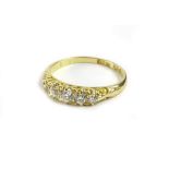 A Victorian 18ct gold gypsy ring, set with five round brilliant cut diamonds, in claw setting,