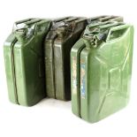 Four green painted military use jerry cans