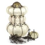 A Continental wrought iron and grey glass hall lantern, with suspension chains etc., 36cm H.