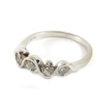 An 18ct white gold four stone diamond ring, with four round brilliant cut diamonds, each with