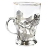 A WMF polished pewter cup, cast in Art Nouveau style with female mask ribbons etc., associated glass